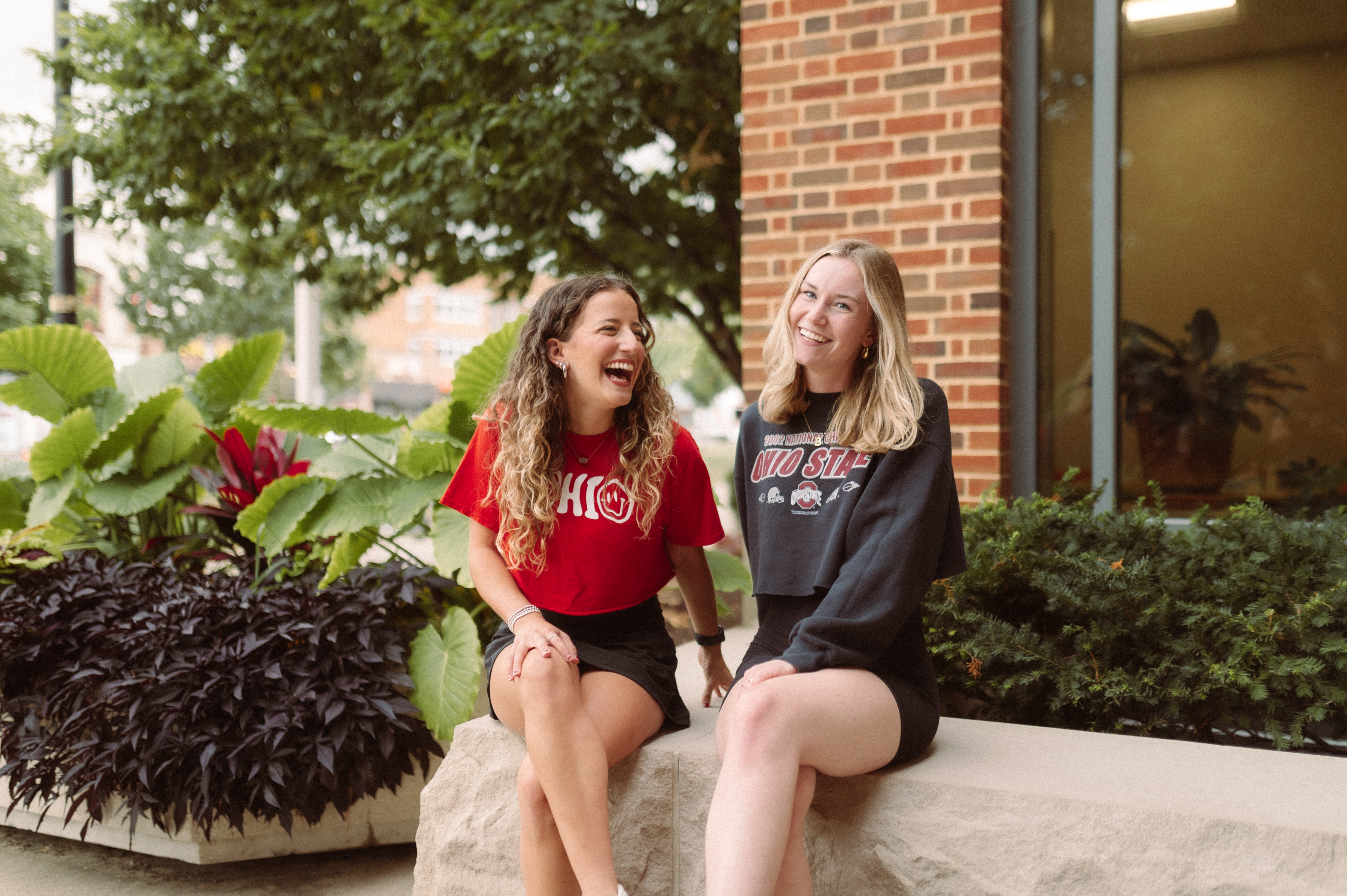 two girls outside of Ohio Union smiling and laughing