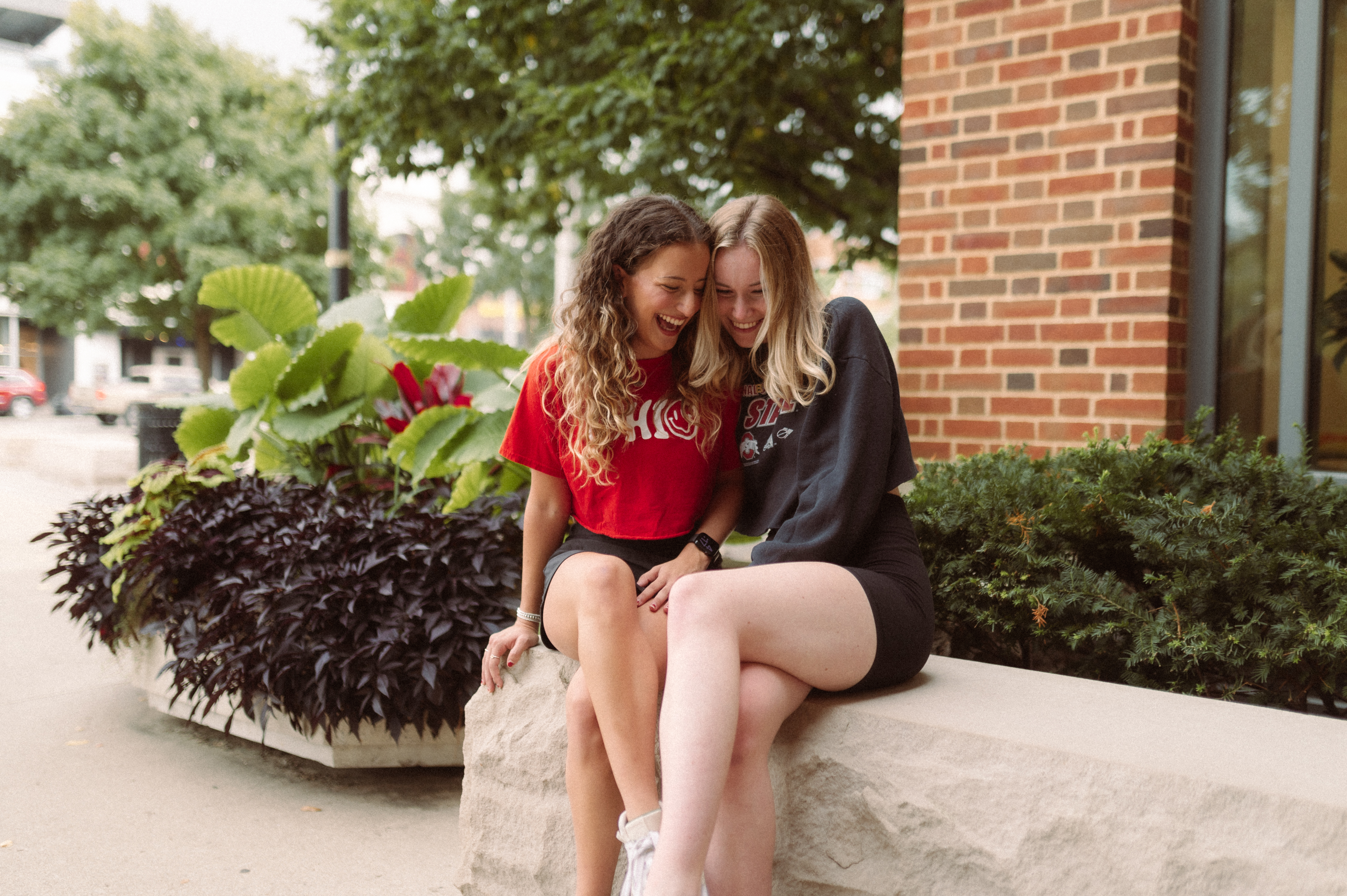 two girls laughing together near the ohio union at OSU