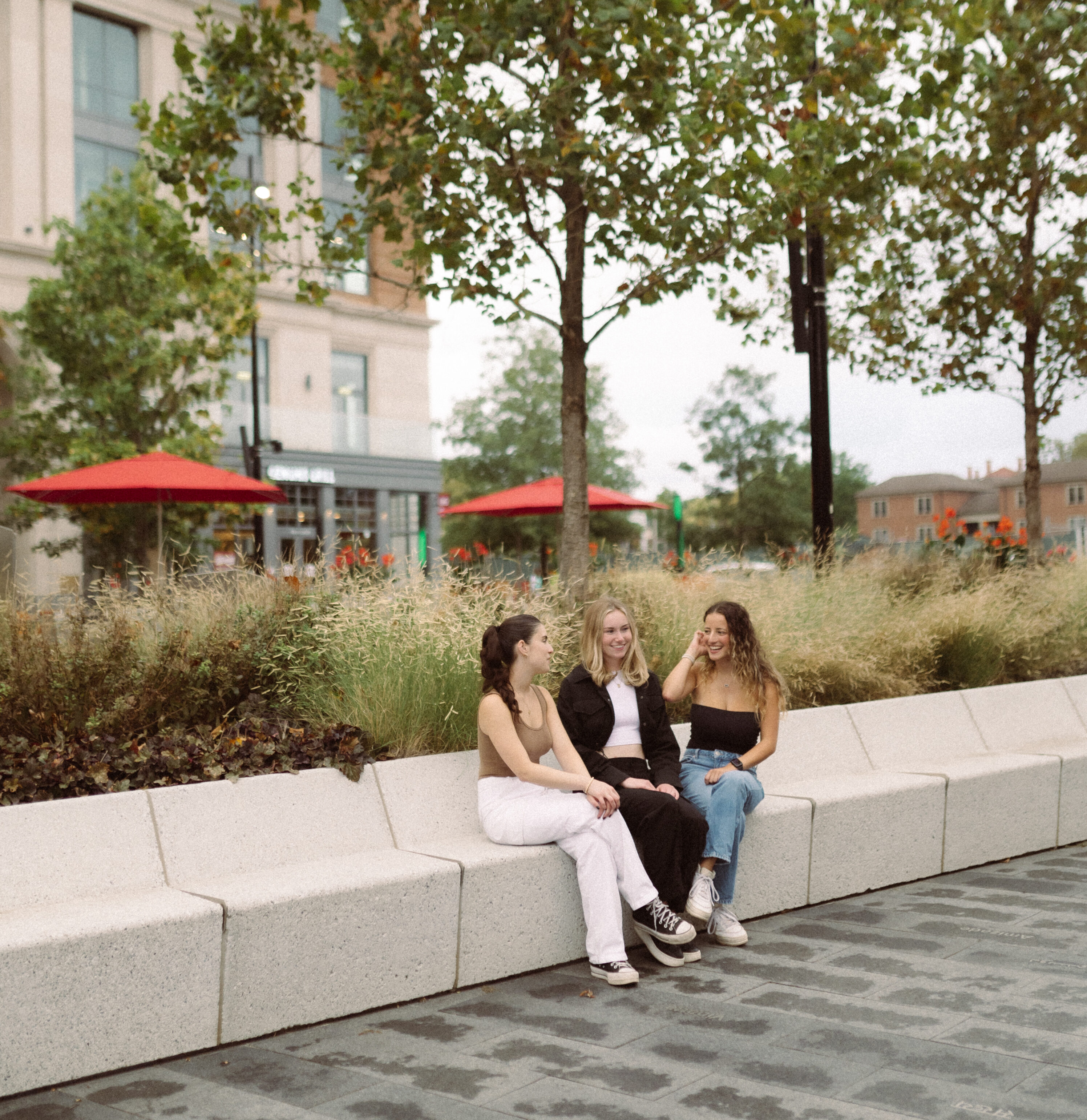 3 girls sitting and talking off campus near osu