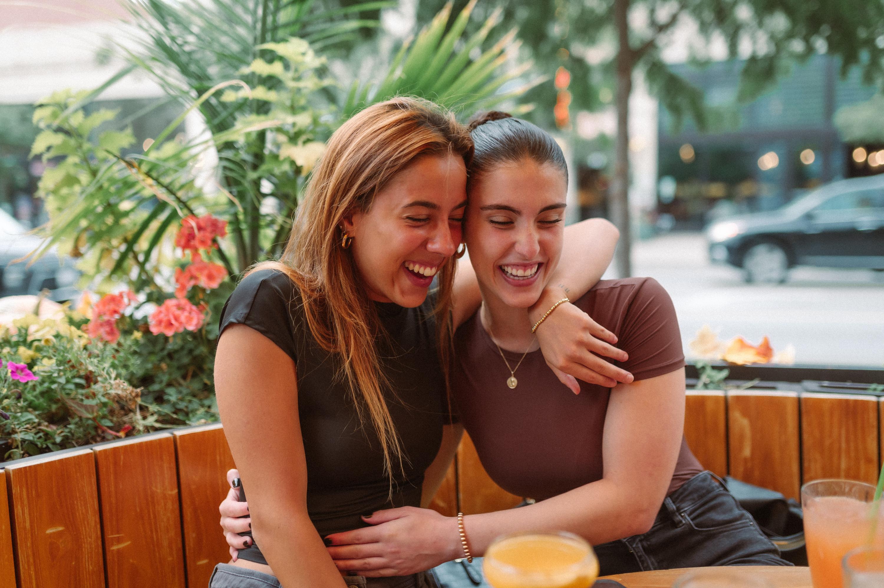 two friends hugging at a student apartment near Columbus