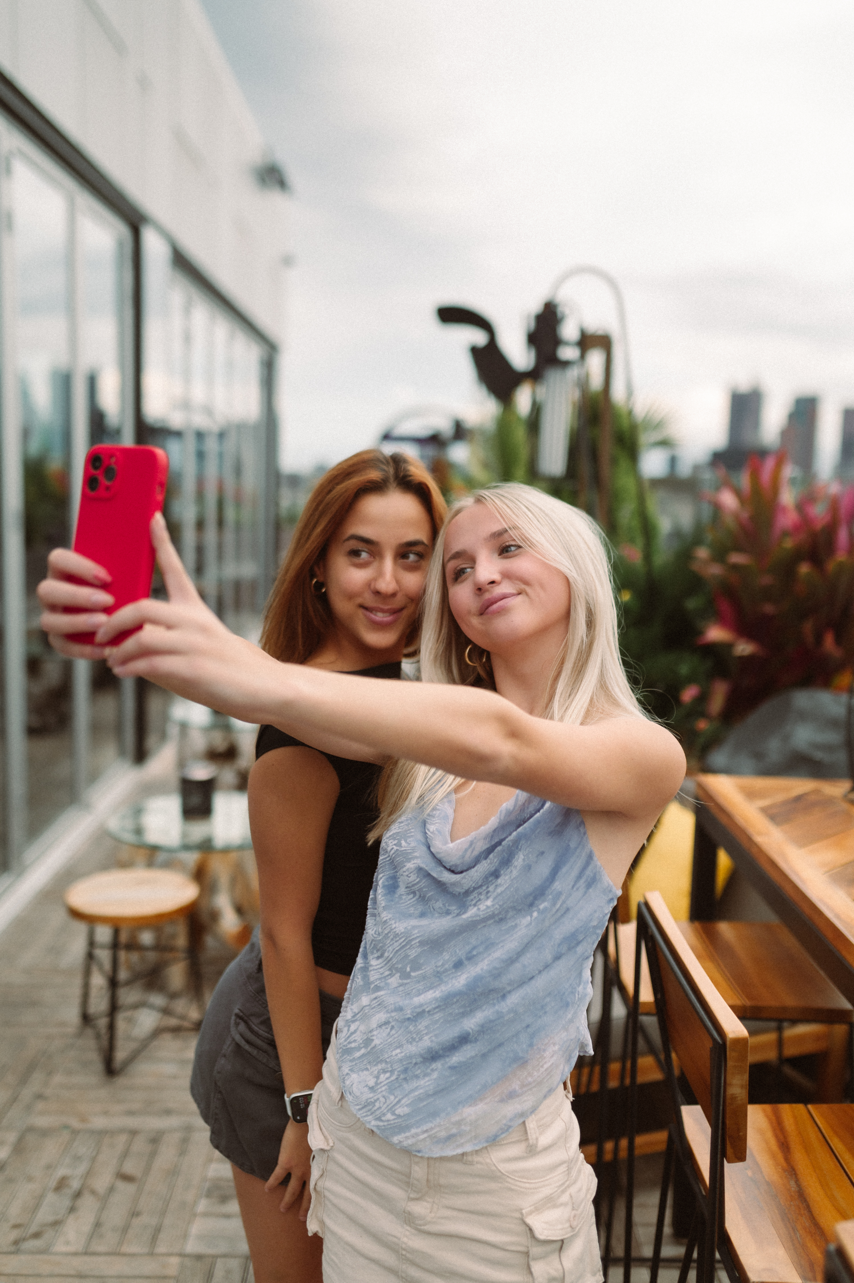 2 girls taking a selfie on a rooftop in the short north in columbus ohio