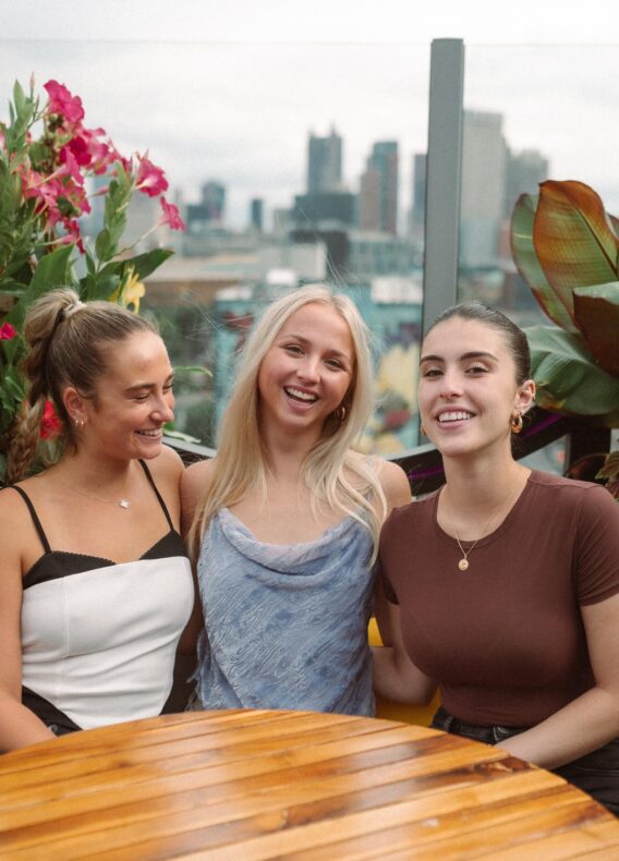 3 girls at a table at mandrake OSU rooftop