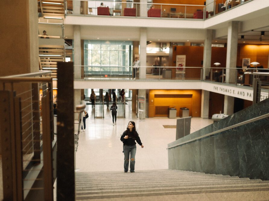 Girl walking up the stairs at Thompson