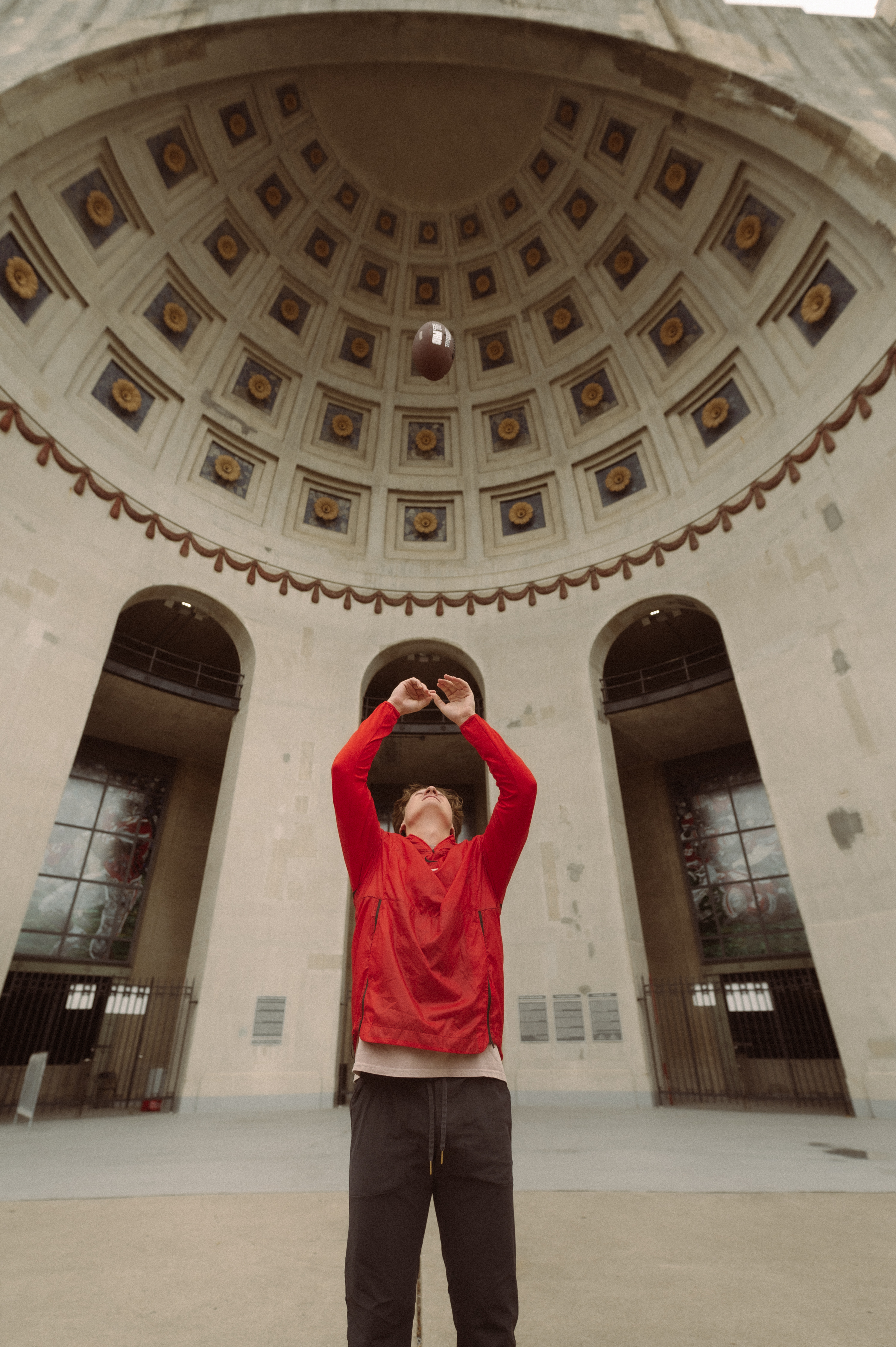 Boy throwing ball in Ohio State rotunda