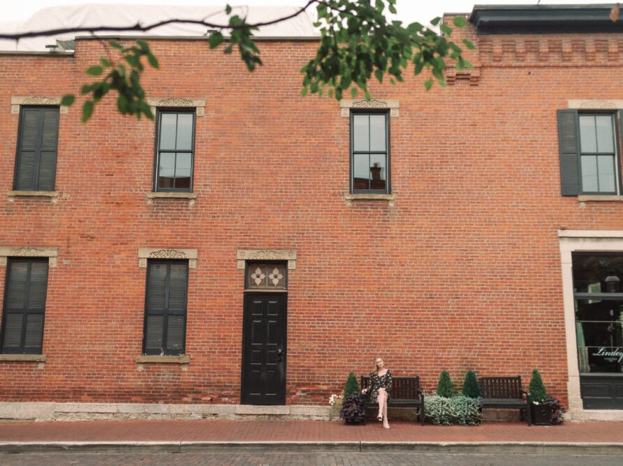 girl sitting on bench in German Village