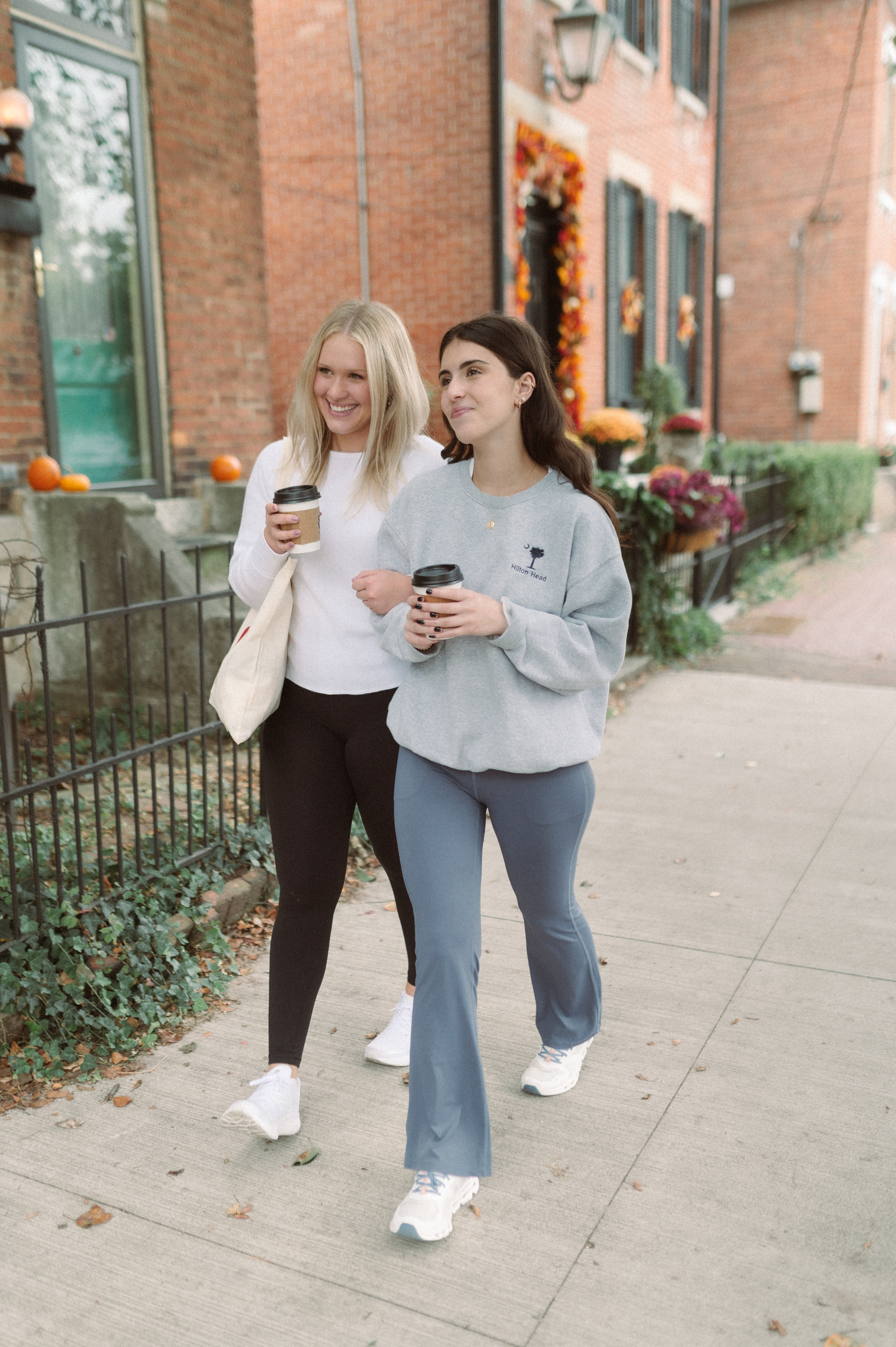 two girls walking in the german village near OSU