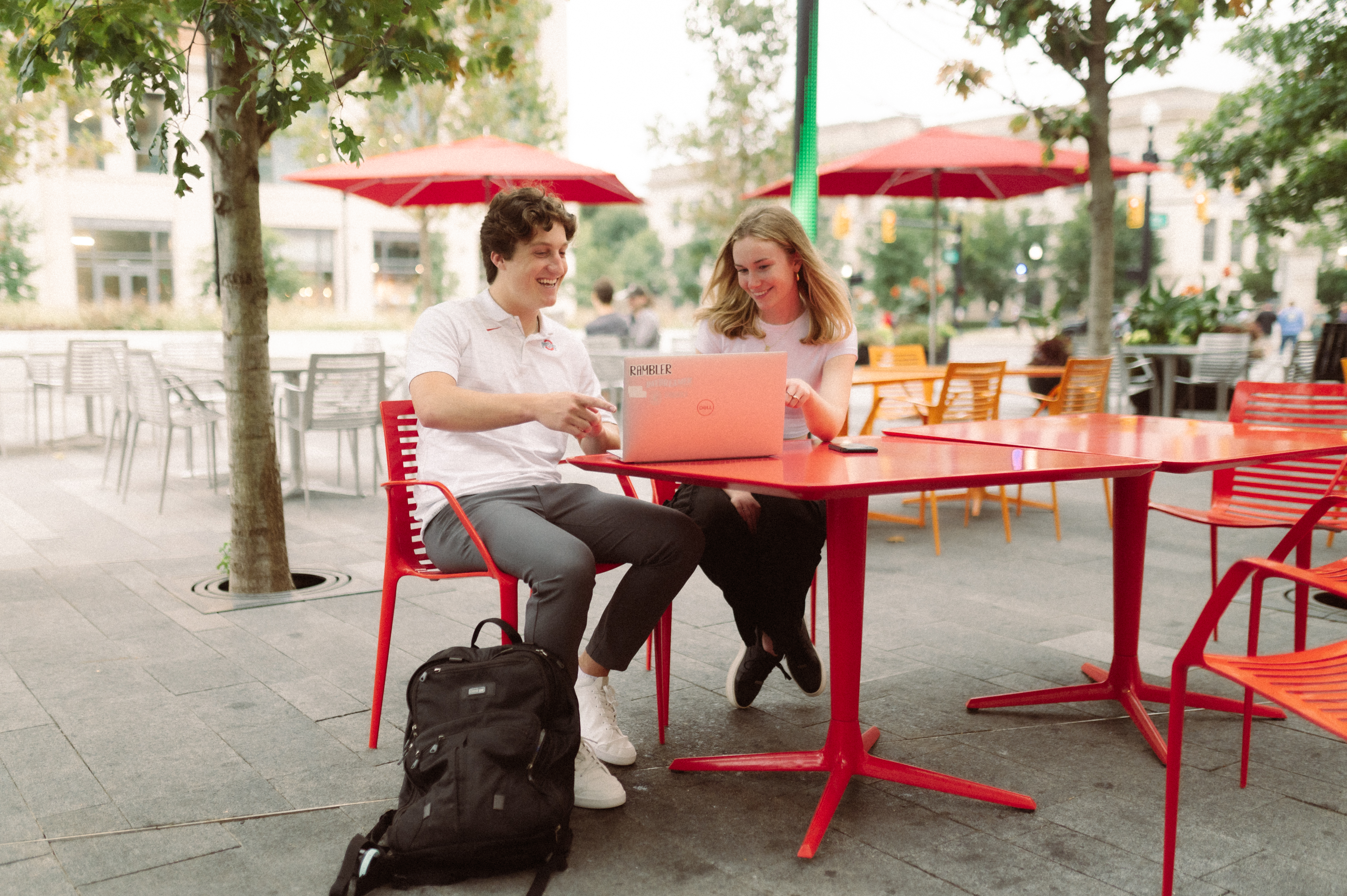 two students studying by ohio states campus