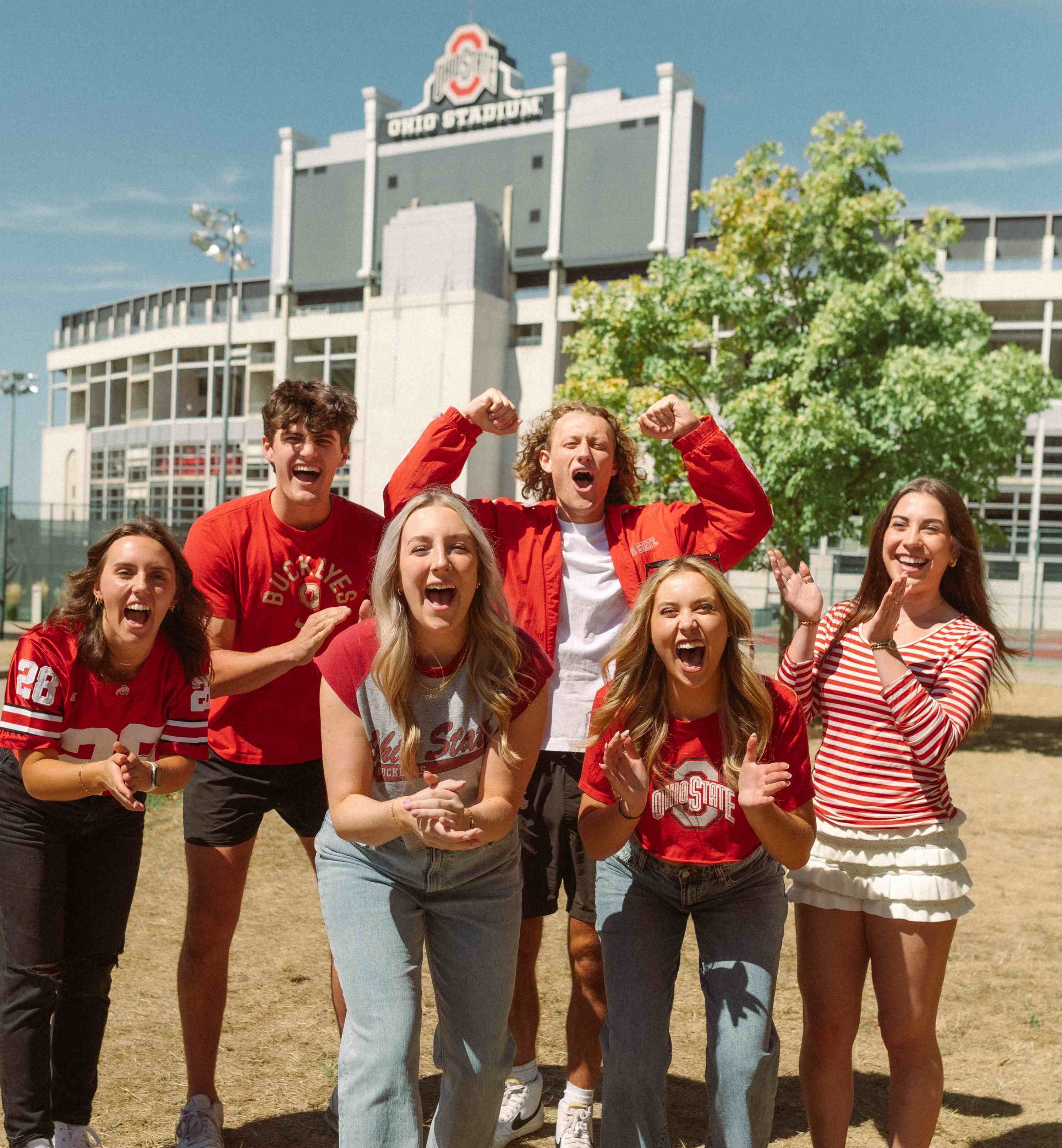 Six people cheering