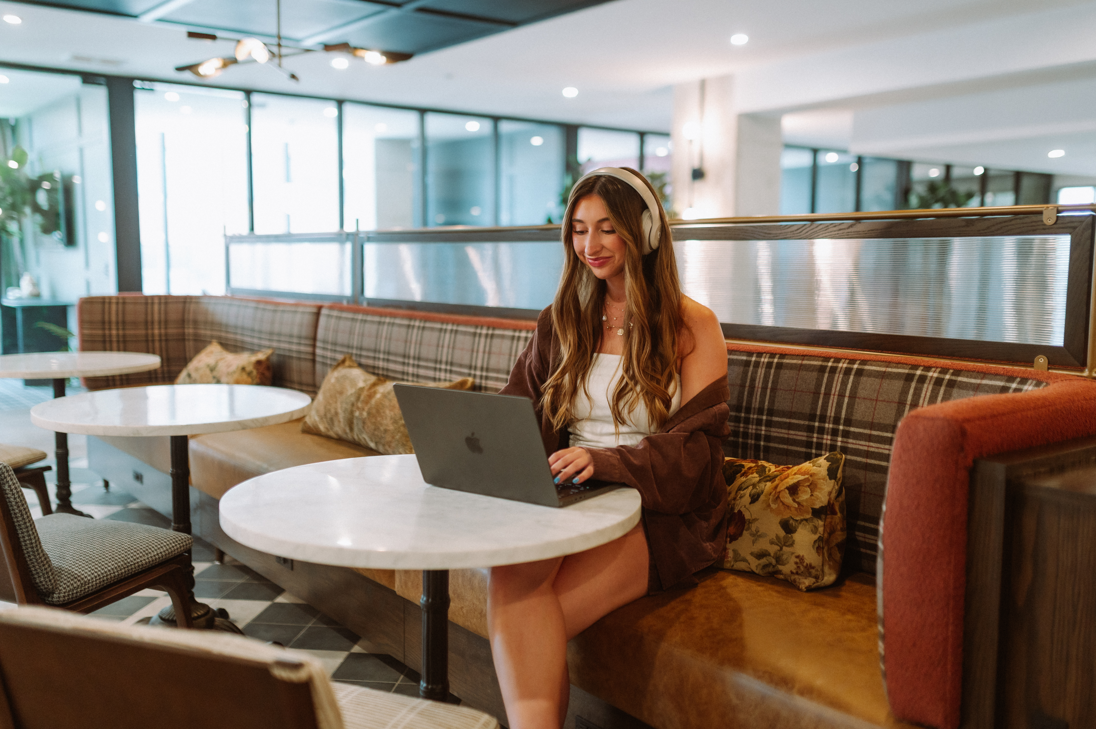 Resident on her laptop in the study space at Rambler Columbus. 