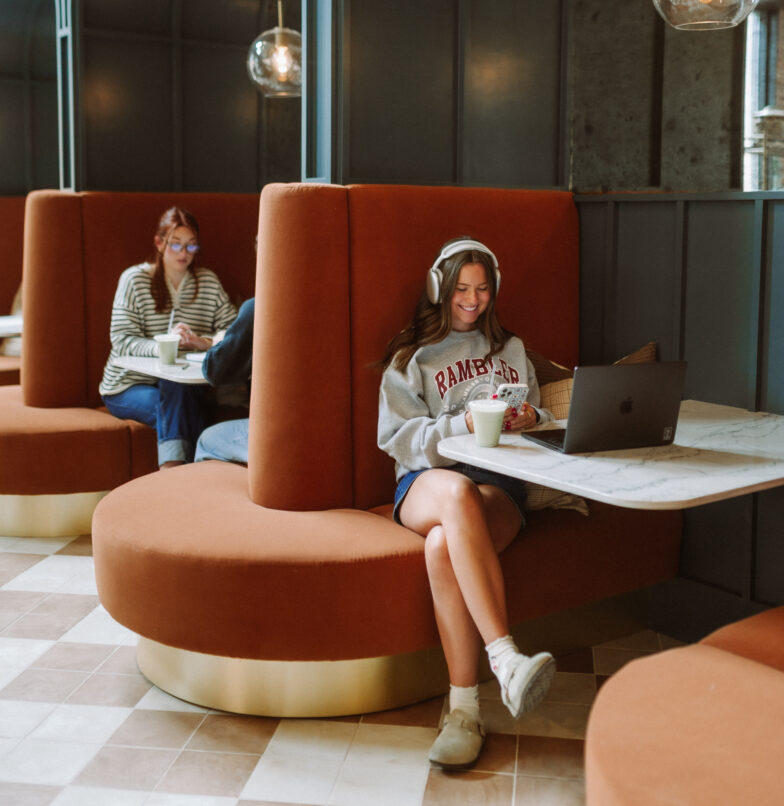 Two residents studying at Daydreamer Cafe in Rambler Columbus