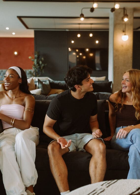 friends talking on couch at rambler col