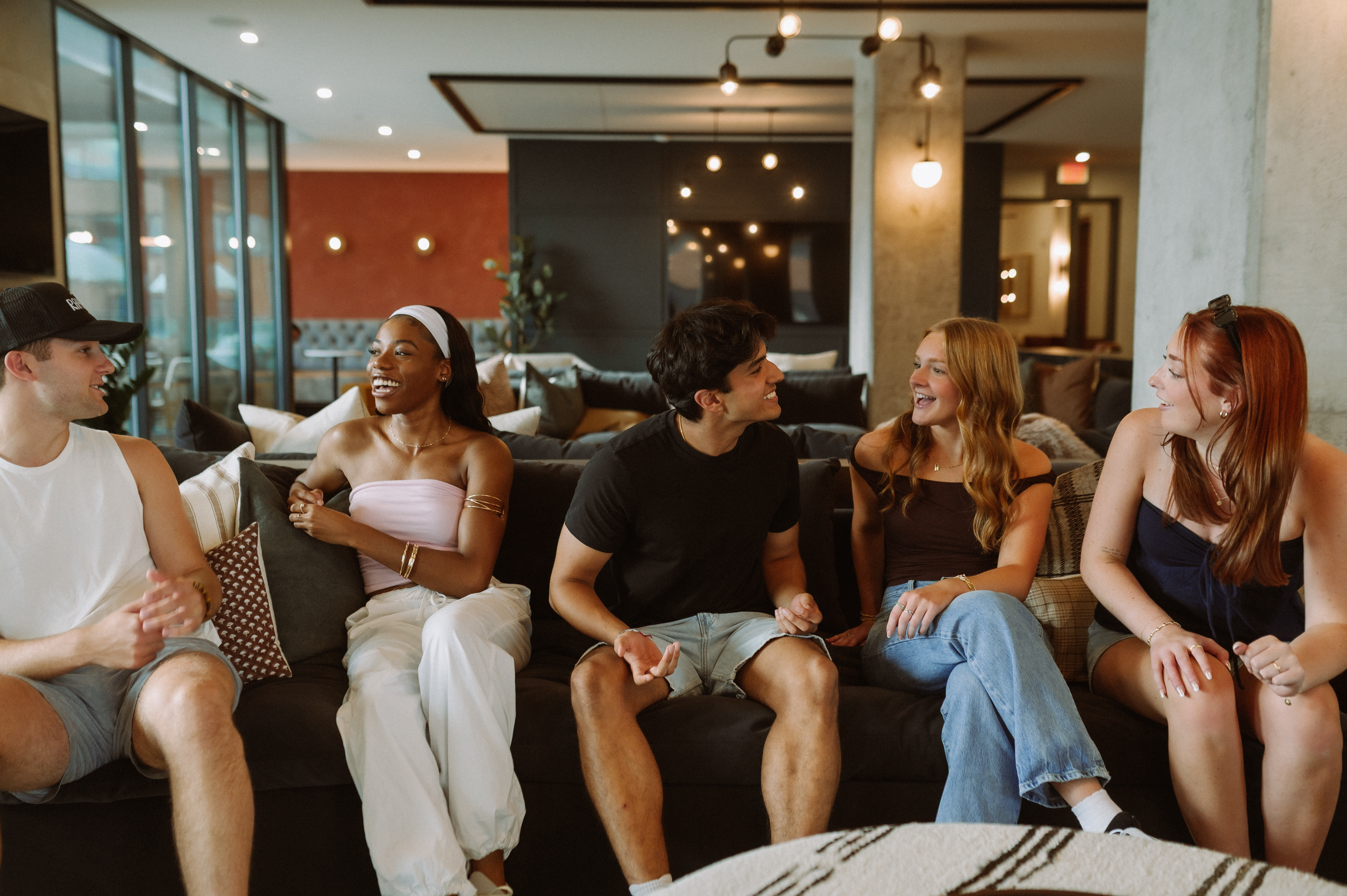 Residents hanging out in the common area of Rambler Columbus.